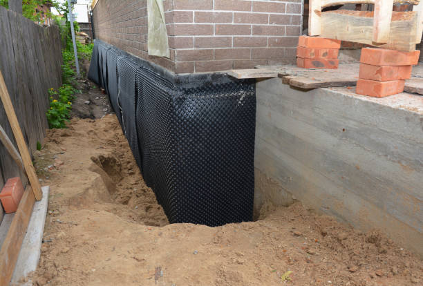 Happy homeowners after waterproofing job in Jacksons Gap